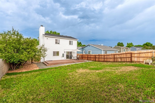4714 S Simms Ct, Morrison, CO 80465 - rear view of property featuring a fenced backyard, a chimney, and a deck