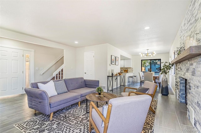 18751 E Mexico Ave, Aurora, CO 80017 - living room with stairs, a chandelier, and recessed lighting
