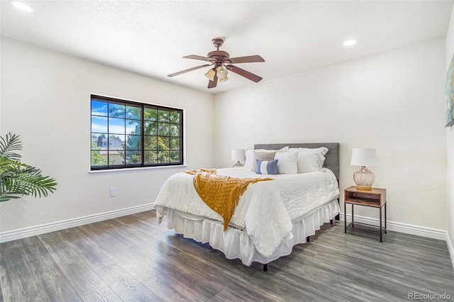 18751 E Mexico Ave, Aurora, CO 80017 - bedroom with dark wood finished floors, recessed lighting, and ceiling fan