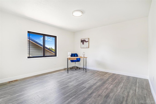 18751 E Mexico Ave, Aurora, CO 80017 - unfurnished office featuring wood finished floors and baseboards