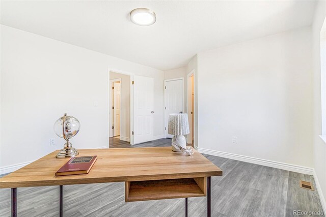 18751 E Mexico Ave, Aurora, CO 80017 - home office with wood finished floors and baseboards