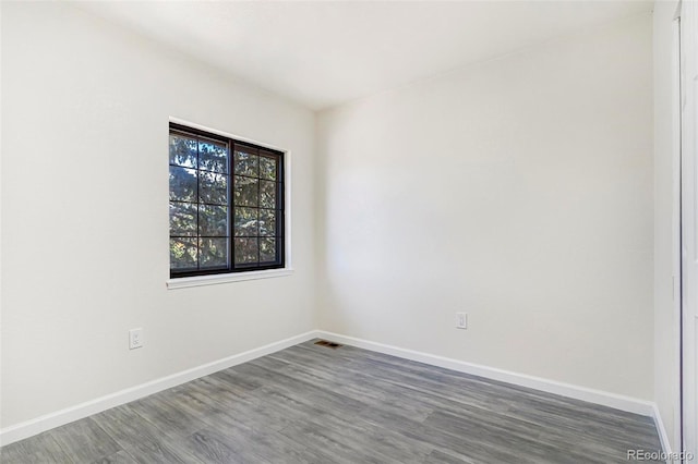 18751 E Mexico Ave, Aurora, CO 80017 - unfurnished room featuring wood finished floors and baseboards