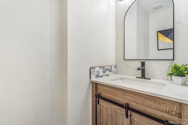 18751 E Mexico Ave, Aurora, CO 80017 - bathroom with vanity and backsplash