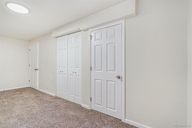 18751 E Mexico Ave, Aurora, CO 80017 - unfurnished bedroom with carpet floors and a closet