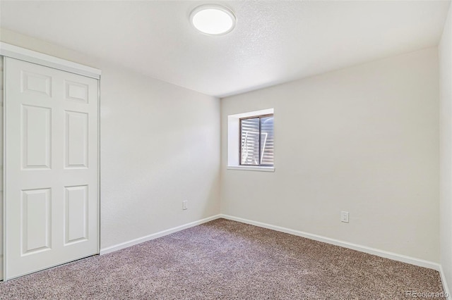 18751 E Mexico Ave, Aurora, CO 80017 - unfurnished bedroom with carpet floors and baseboards