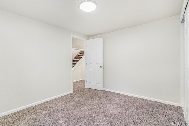 18751 E Mexico Ave, Aurora, CO 80017 - spare room with carpet flooring and stairs