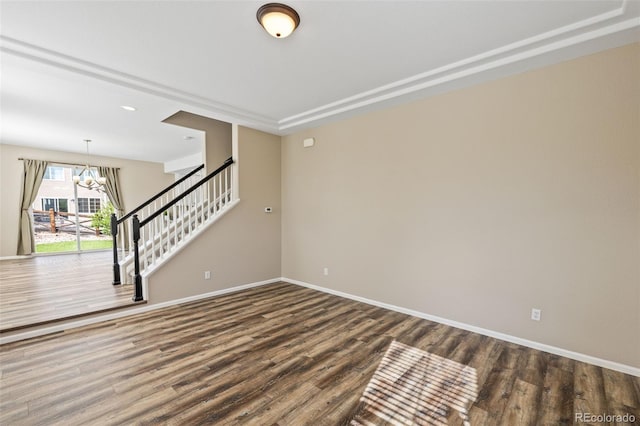8216 Mahogany Wood Ct, Colorado Springs, CO 80927 - spare room with a chandelier, wood finished floors, and baseboards
