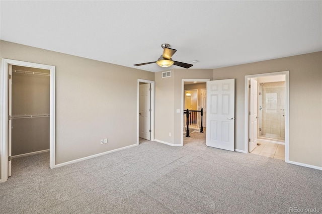 8216 Mahogany Wood Ct, Colorado Springs, CO 80927 - unfurnished bedroom with carpet floors, a walk in closet, baseboards, connected bathroom, and a ceiling fan
