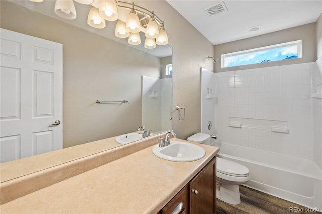 8216 Mahogany Wood Ct, Colorado Springs, CO 80927 - full bathroom with toilet, vanity, bathtub / shower combination, and wood finished floors