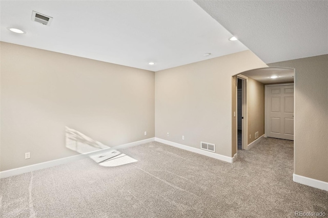 8216 Mahogany Wood Ct, Colorado Springs, CO 80927 - empty room with arched walkways, carpet floors, baseboards, and recessed lighting