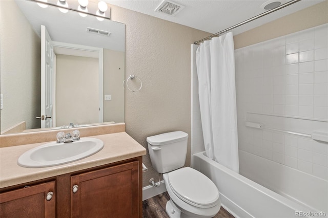 8216 Mahogany Wood Ct, Colorado Springs, CO 80927 - full bath featuring vanity, toilet, shower / bathtub combination with curtain, wood finished floors, and a textured wall