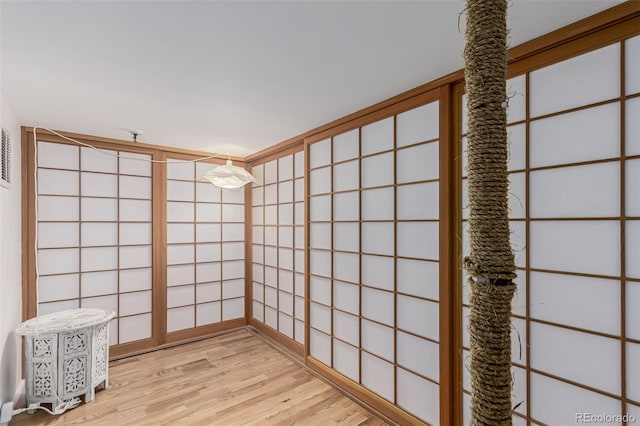 spare room featuring light wood-type flooring