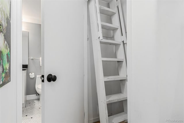 bathroom with tile patterned flooring and toilet