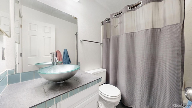 bathroom with sink and toilet