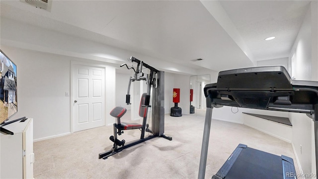 workout room with light colored carpet