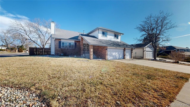 view of front of home featuring a garage and a front lawn