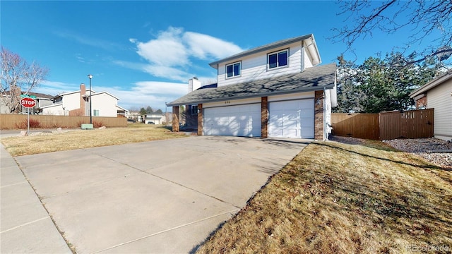 exterior space with a yard and a garage