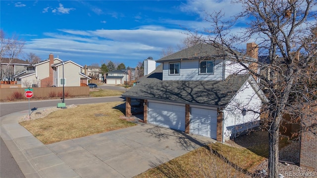 exterior space with a front yard and a garage