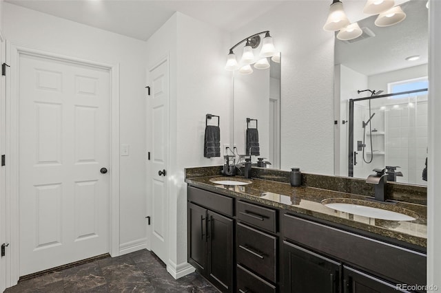 10226 Worchester St, Commerce City, CO 80022 - full bathroom featuring a sink, baseboards, double vanity, and a stall shower
