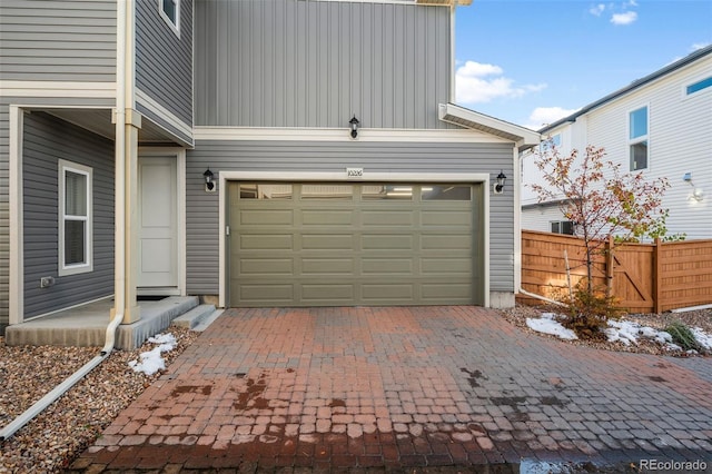 10226 Worchester St, Commerce City, CO 80022 - garage featuring driveway and fence