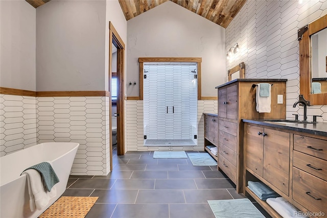 full bathroom with plus walk in shower, vanity, tile walls, and wooden ceiling