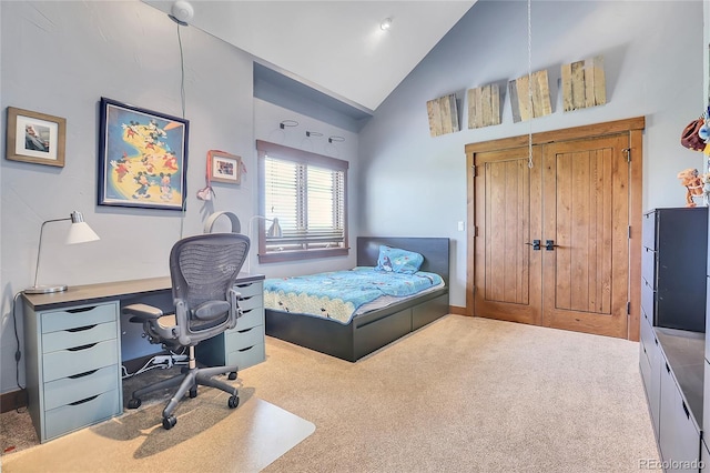 carpeted bedroom with vaulted ceiling