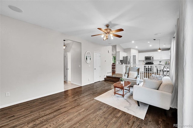 10571 Garfield St, Thornton, CO 80233 - living area with a ceiling fan, wood finished floors, baseboards, and recessed lighting