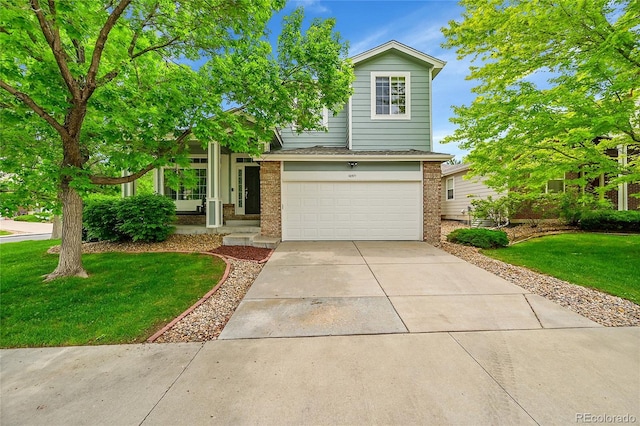 10571 Garfield St, Thornton, CO 80233 - view of front of house featuring brick siding, an attached garage, a front yard, and driveway