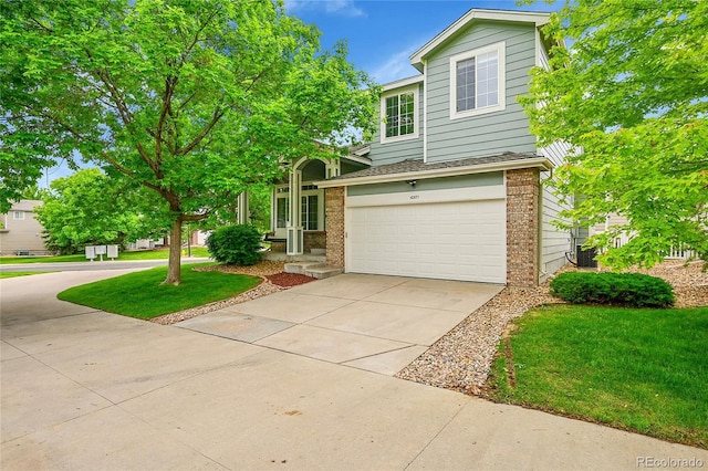 10571 Garfield St, Thornton, CO 80233 - view of front of home featuring brick siding, driveway, a garage, a front lawn, and a shingled roof