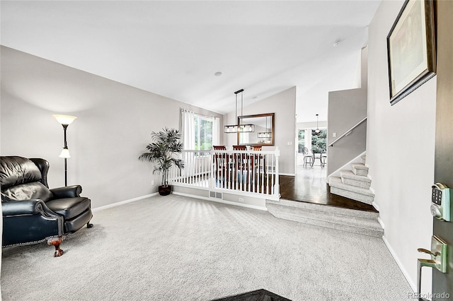 10571 Garfield St, Thornton, CO 80233 - sitting room with vaulted ceiling, carpet floors, plenty of natural light, baseboards, and stairway