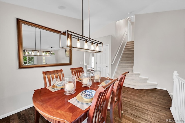 10571 Garfield St, Thornton, CO 80233 - dining space with baseboards, wood finished floors, and stairs
