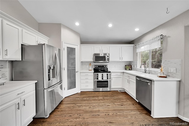 10571 Garfield St, Thornton, CO 80233 - kitchen with stainless steel appliances, a sink, white cabinets, and recessed lighting