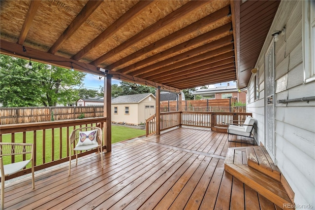 6327 Fenton St, Arvada, CO 80003 - wooden deck with a fenced backyard and an outbuilding