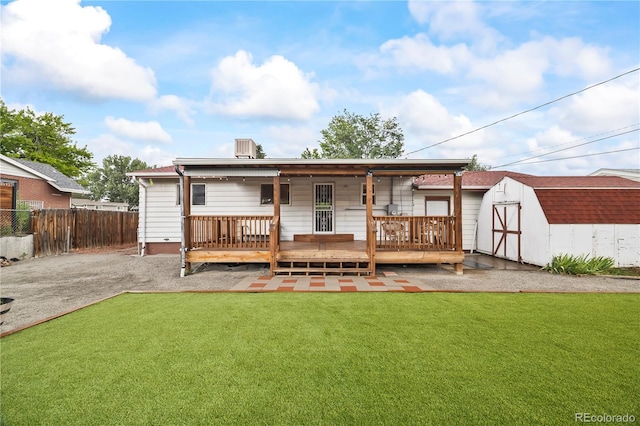 6327 Fenton St, Arvada, CO 80003 - rear view of property with a shed and a wooden deck