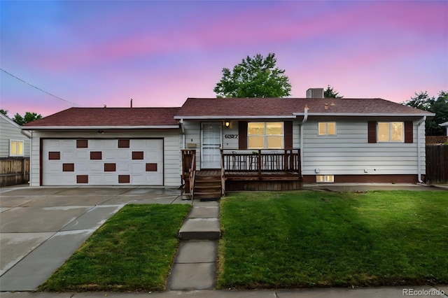 6327 Fenton St, Arvada, CO 80003 - ranch-style house featuring driveway, a garage, and covered porch