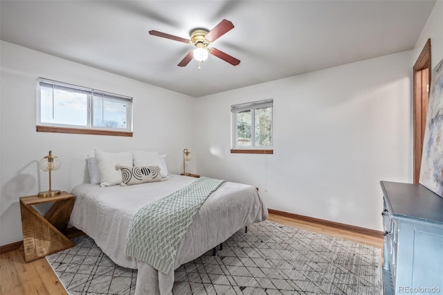 bedroom featuring ceiling fan and light hardwood / wood-style floors