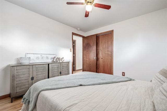 bedroom featuring ceiling fan and light hardwood / wood-style flooring