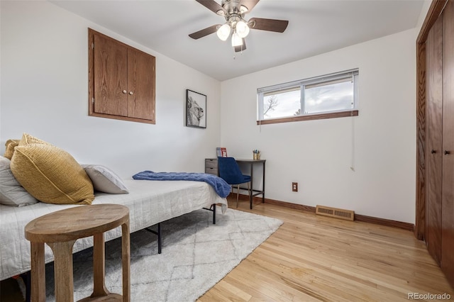 bedroom with light hardwood / wood-style flooring and ceiling fan