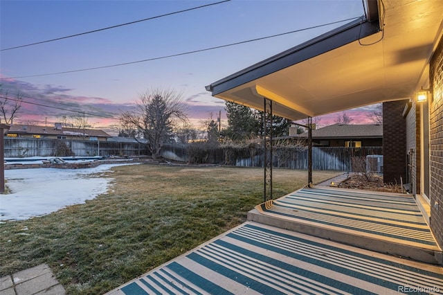 yard at dusk with a patio