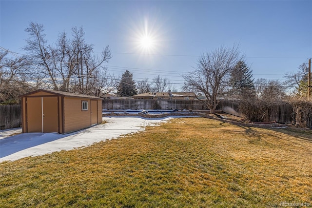 view of yard with a storage shed and a patio