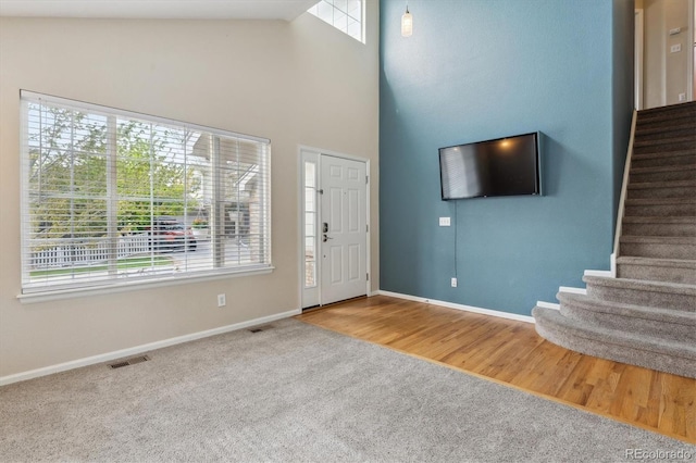 10517 Madison St, Thornton, CO 80233 - entrance foyer with stairs, carpet floors, baseboards, and a towering ceiling