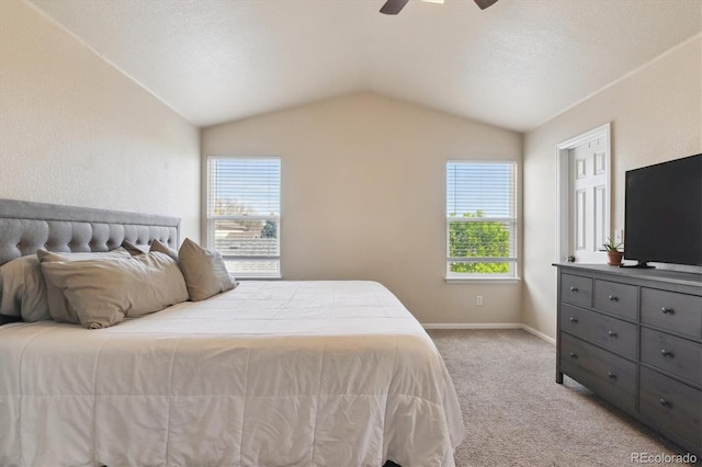 10517 Madison St, Thornton, CO 80233 - bedroom with lofted ceiling, multiple windows, light colored carpet, baseboards, and a ceiling fan