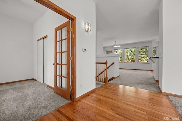 14447 Inca Ct, Westminster, CO 80023 - corridor with an upstairs landing, baseboards, wood finished floors, and carpet flooring