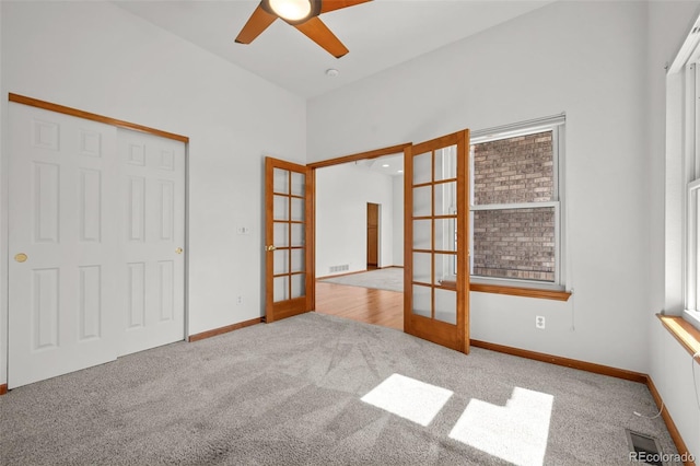 14447 Inca Ct, Westminster, CO 80023 - unfurnished room with french doors, carpet flooring, a ceiling fan, and baseboards