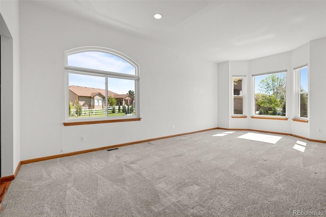 14447 Inca Ct, Westminster, CO 80023 - carpeted empty room featuring plenty of natural light and baseboards