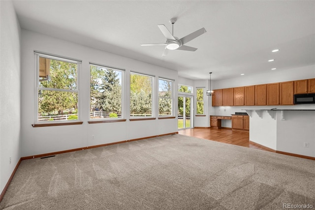 14447 Inca Ct, Westminster, CO 80023 - unfurnished living room featuring carpet floors, baseboards, a ceiling fan, and recessed lighting