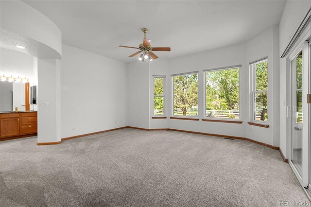 14447 Inca Ct, Westminster, CO 80023 - unfurnished bedroom featuring light carpet, multiple windows, and baseboards