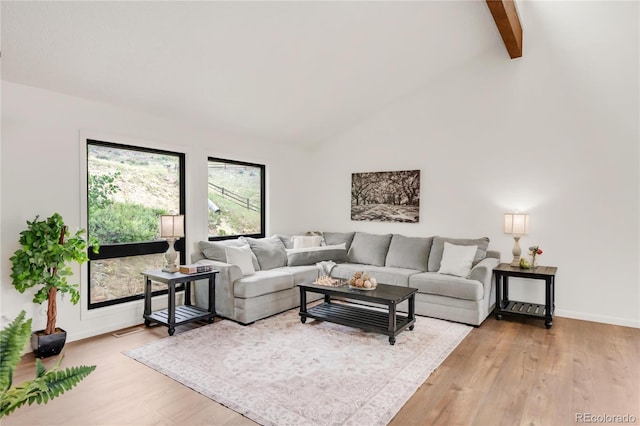 3260 Bit Rd, Evergreen, CO 80439 - living room with wood finished floors, beamed ceiling, and high vaulted ceiling