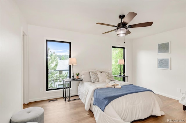 3260 Bit Rd, Evergreen, CO 80439 - bedroom with light wood-style flooring and a ceiling fan