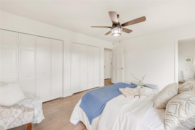3260 Bit Rd, Evergreen, CO 80439 - bedroom featuring two closets, light wood-style flooring, and ceiling fan